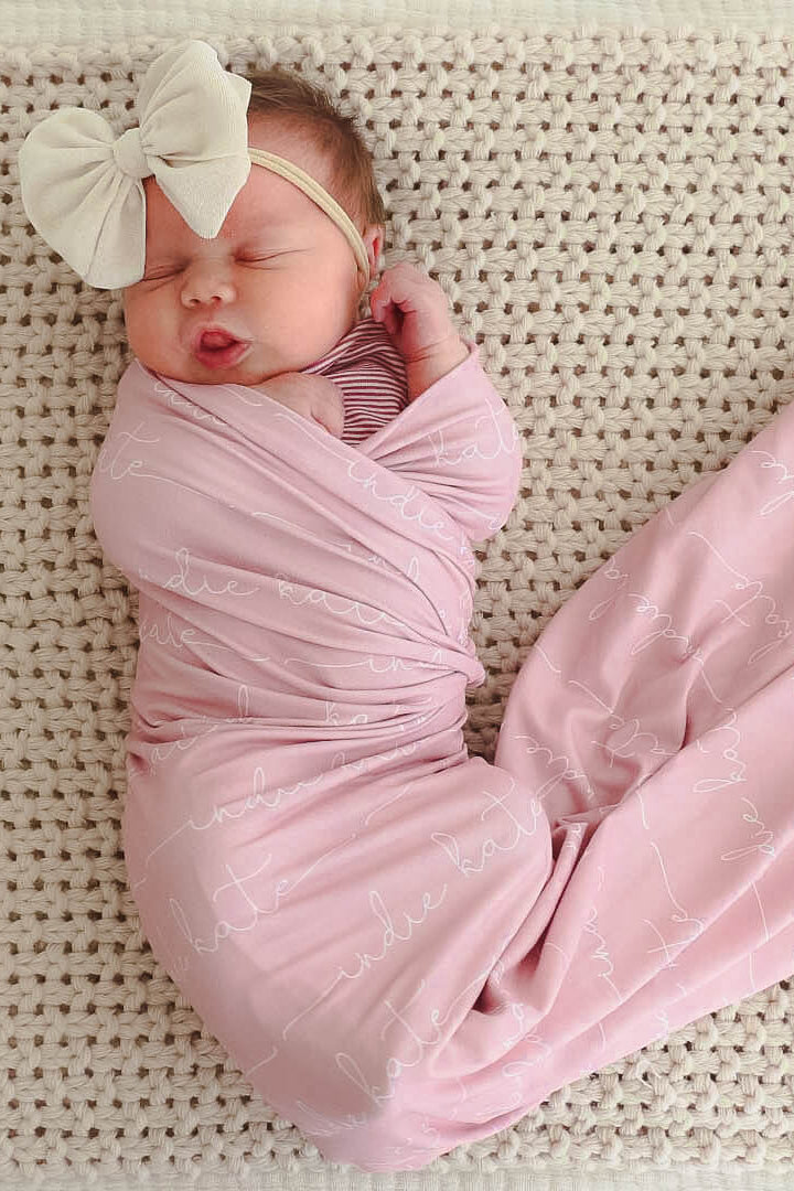 white on  pink personalized baby name swaddle blanket 