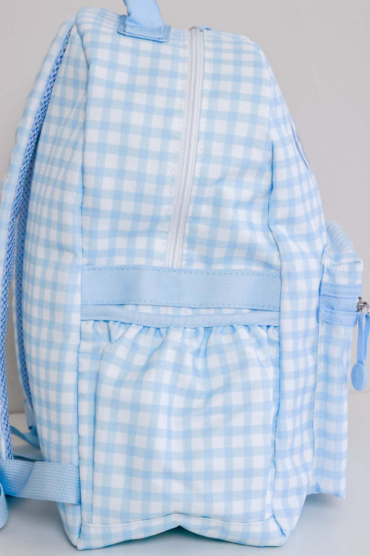 side view of blue gingham backpack 