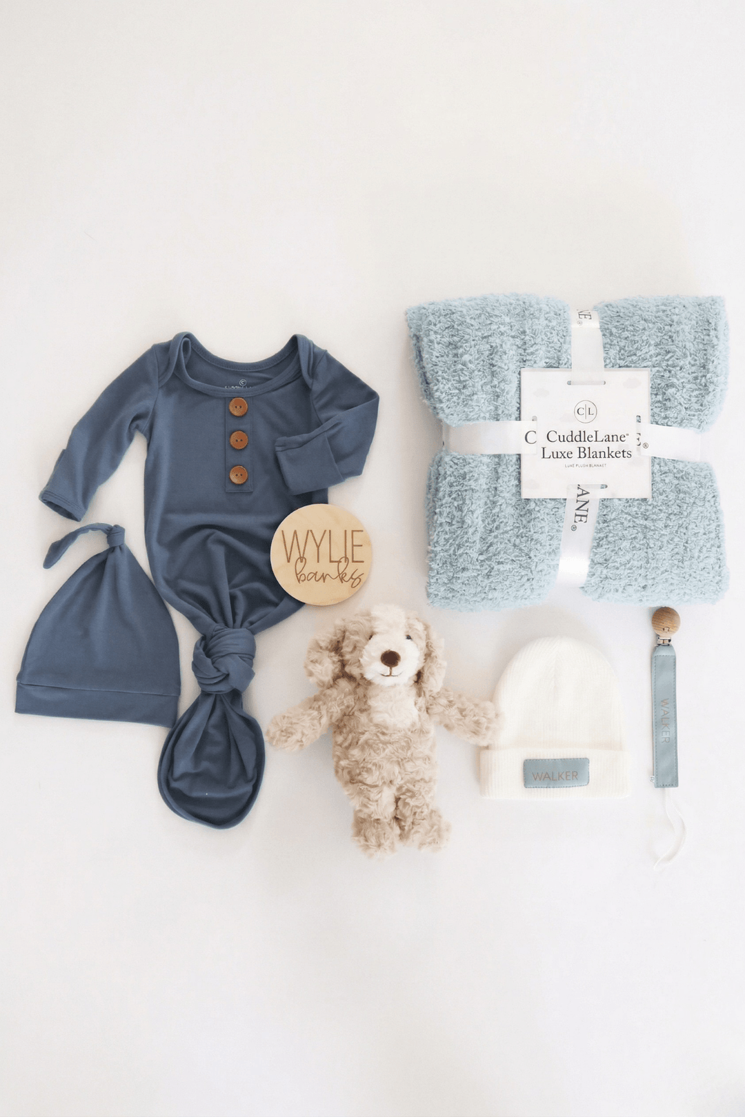baby shower gift box bundle with blue pajamas, blanket and stuffed toy animal for boy