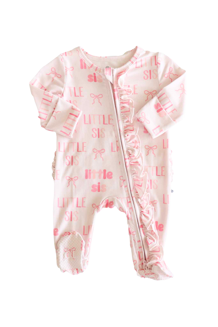 long sleeve ruffle zipper footie for girls with pink bows and block letters that say little sis 