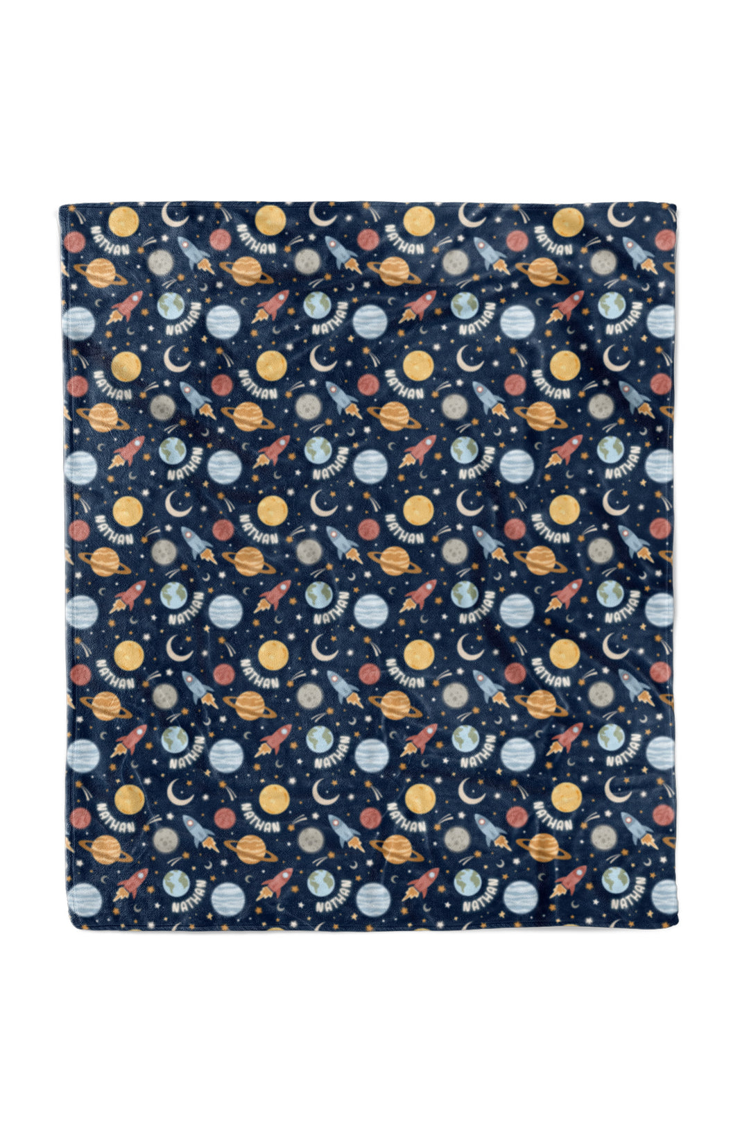 Flat lay of a fully spread Caden Lane navy plush 50x60 blanket in a Stellar Snuggles print featuring planets, rockets, moons, and stars, reading “Nathan.”