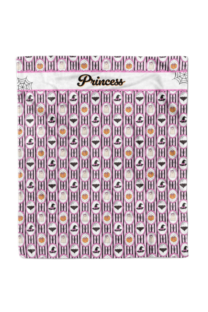 Personalized pink and black Halloween pet blanket with pumpkin, bat, ghost, and witch hat pattern, customized with the name 'Princess' in cursive.