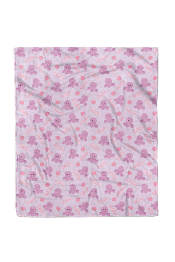 personalized sea snuggles kids blanket flat lay — full view of lavender plush with purple octopus, pink seashells, and custom name