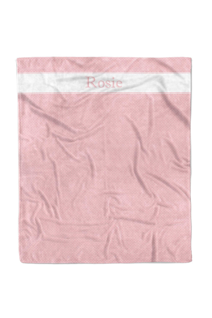 Pink polka dot pet blanket with white satin top border, personalized with the name Rosie in pink script lettering