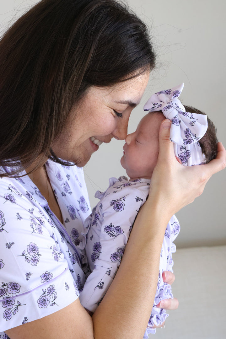 mom holding baby in amethyst garden matching pajamas