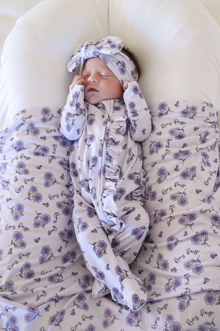 purple rose ruffle zipper footie with matching headwrap and swaddle 
