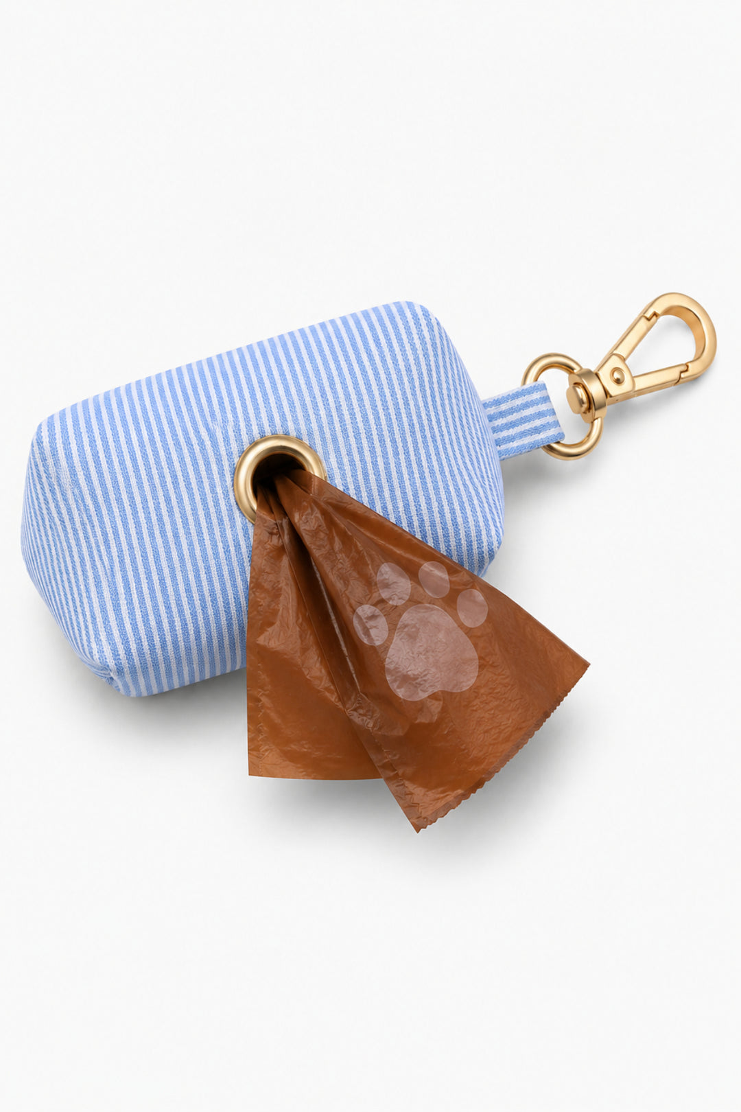 Light blue and white striped Morning Mist pet waste bag holder with a brown waste bag being dispensed from the opening, gold clip attachment visible