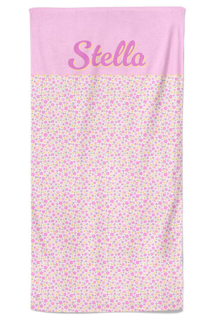 Personalized pet towel in Scattered Blooms print with solid pink top panel featuring pet name in script lettering and colorful floral print on the main body