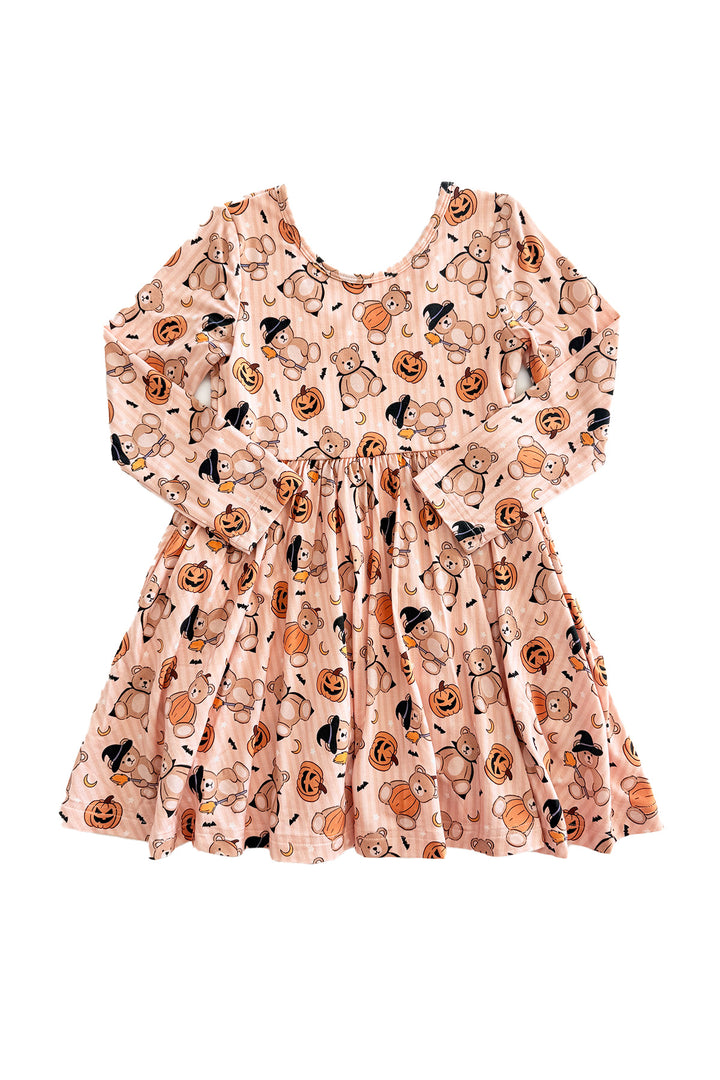 Caden Lane A long-sleeve babydoll dress with an orange base and an all-over Halloween print featuring pumpkins, crows, and witch hats, shown flat against a white background.