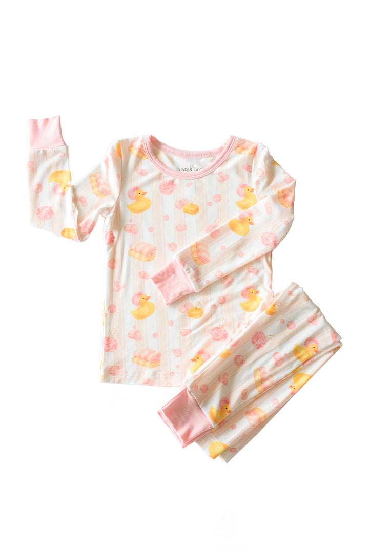 Pink Bubble Duckies two-piece bamboo pajama set flat lay showing long sleeve top and pants with yellow duck print