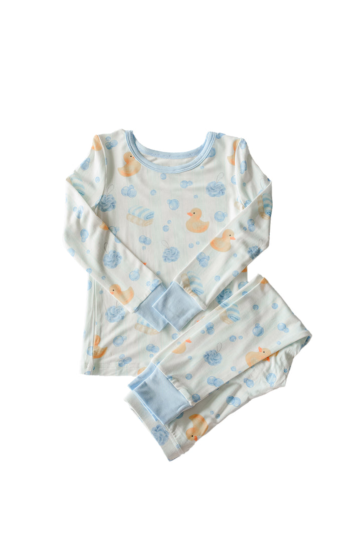 Blue Bubble Duckies two-piece bamboo pajama set flat lay showing long sleeve top and pants with yellow duck print