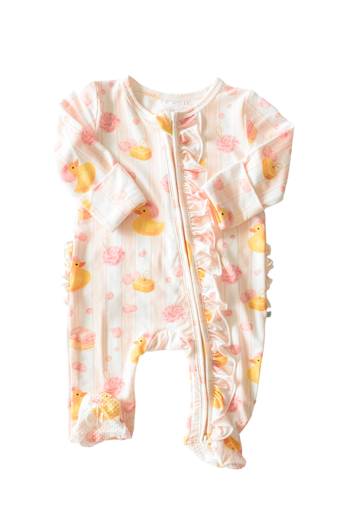Pink Bubble Duckies ruffle bamboo zipper footie flat lay showing full design with ruffles and yellow duck print