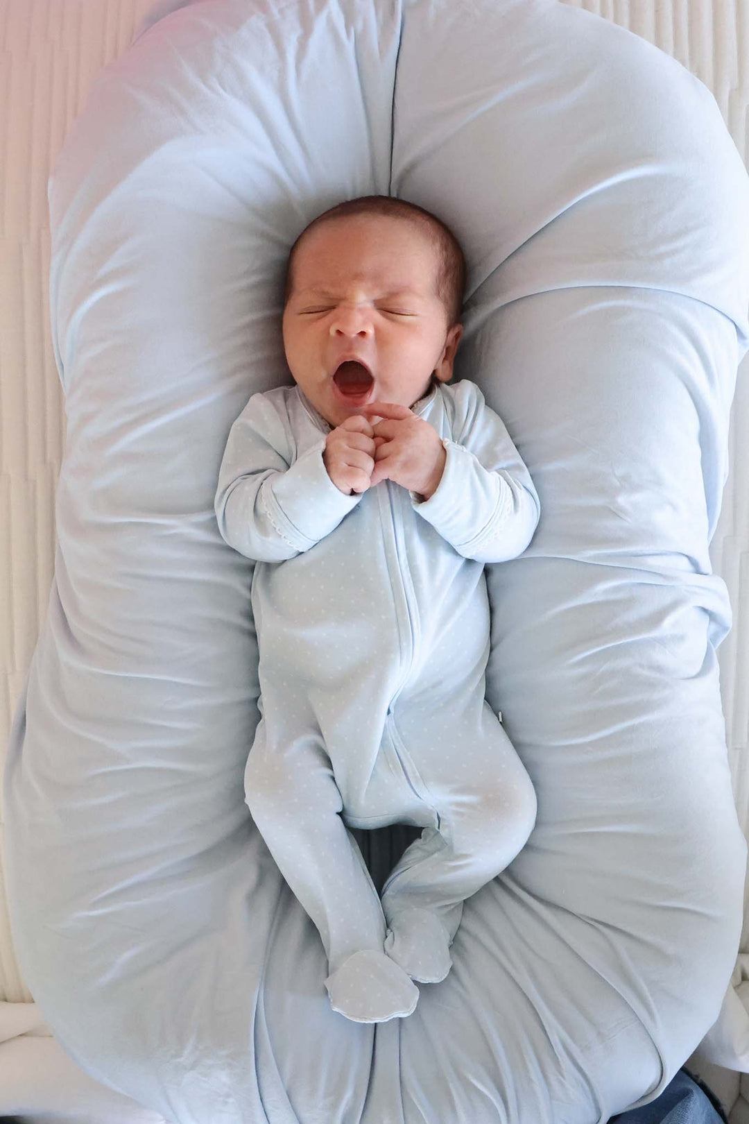 newborn in blue picot trim bamboo zipper footie