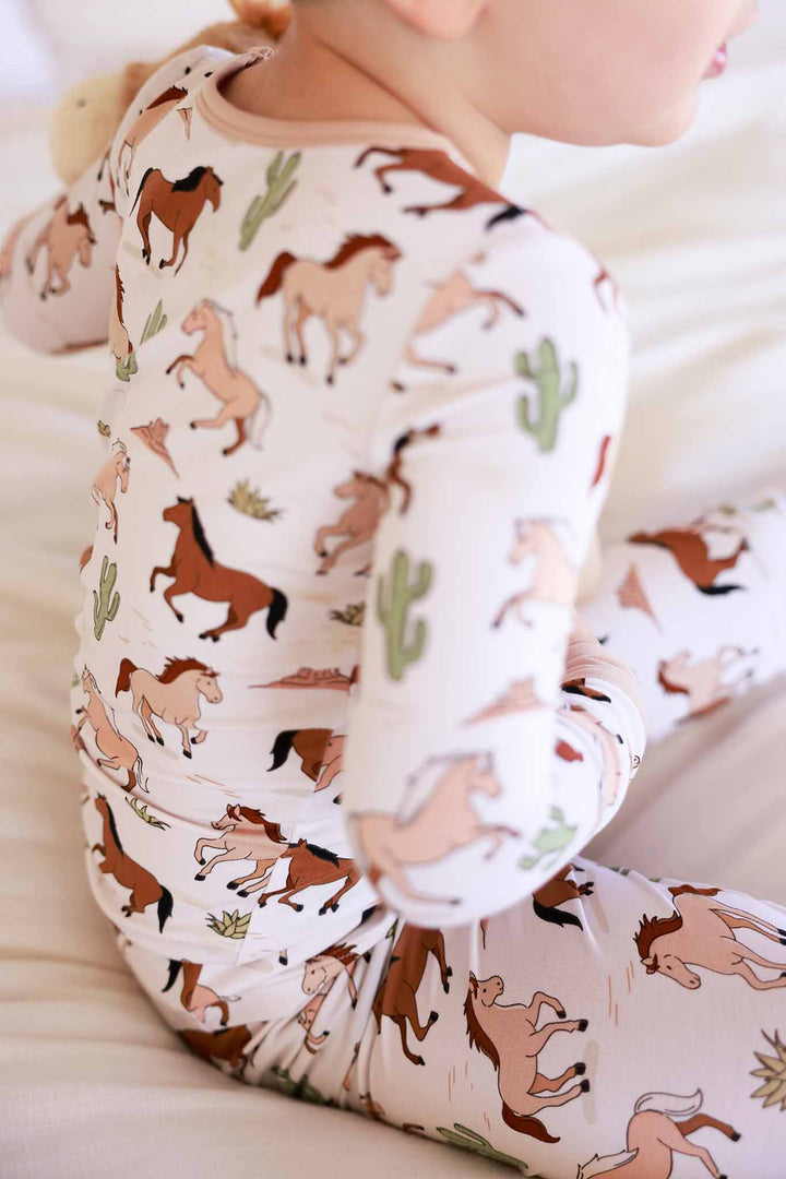 closeup of neutral pony club pajama set 