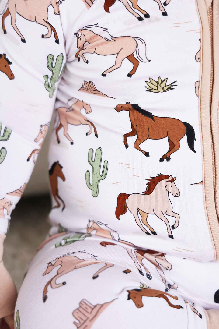 closeup of horse and cactus convertible zip romper pajama for boys 