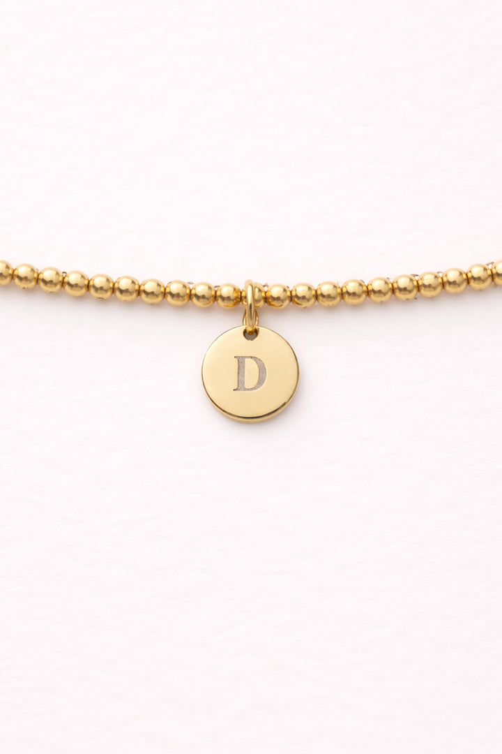 engraved circle charm beaded bracelet