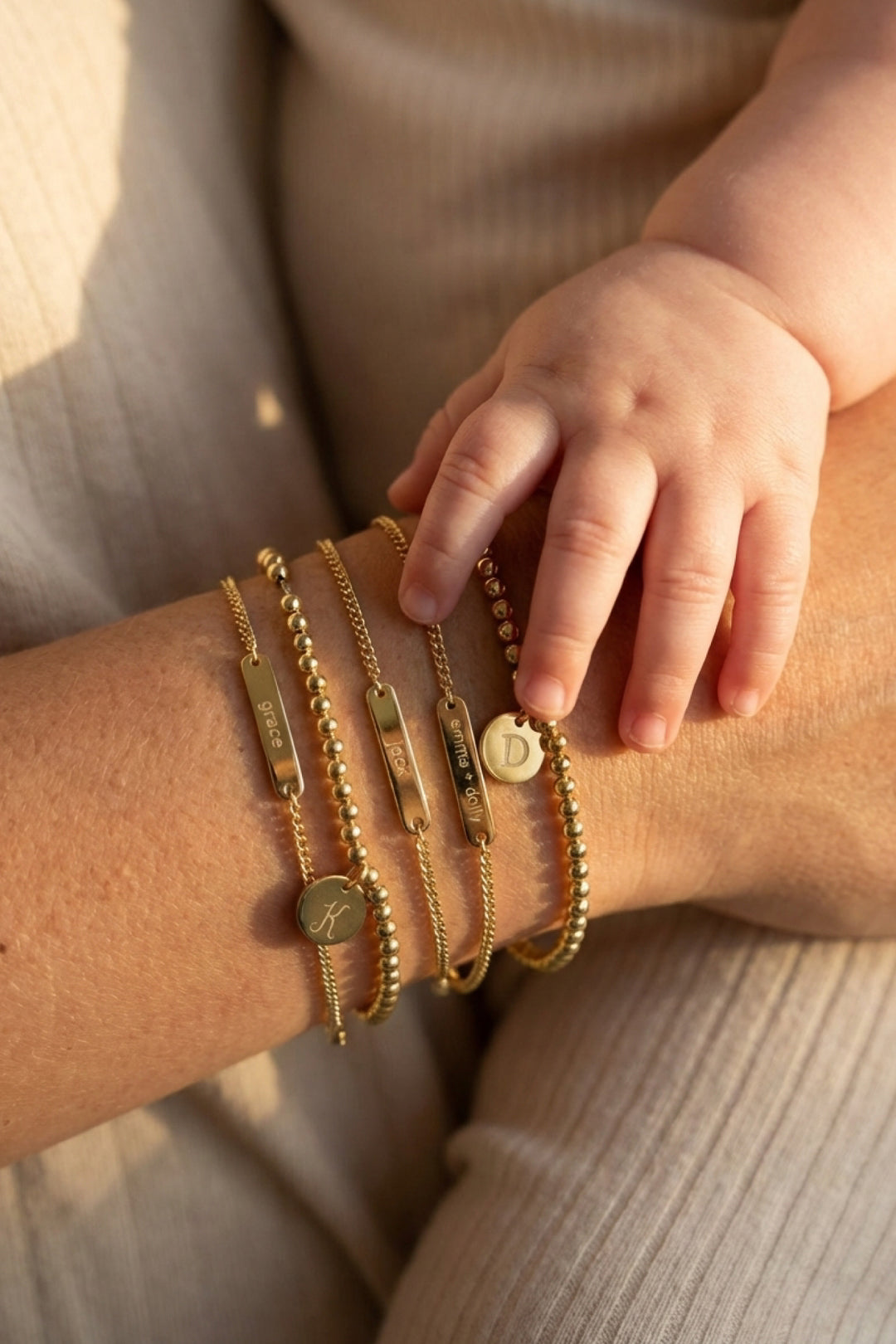 gold bracelet stack for moms in bar and circle charm style