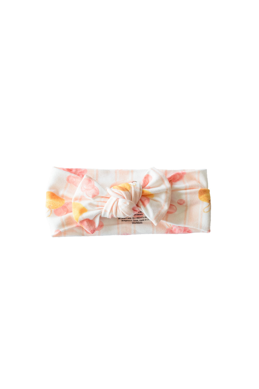 Pink Bubble Duckies knit large bow headwrap with yellow rubber duck and pink bubble print on white background