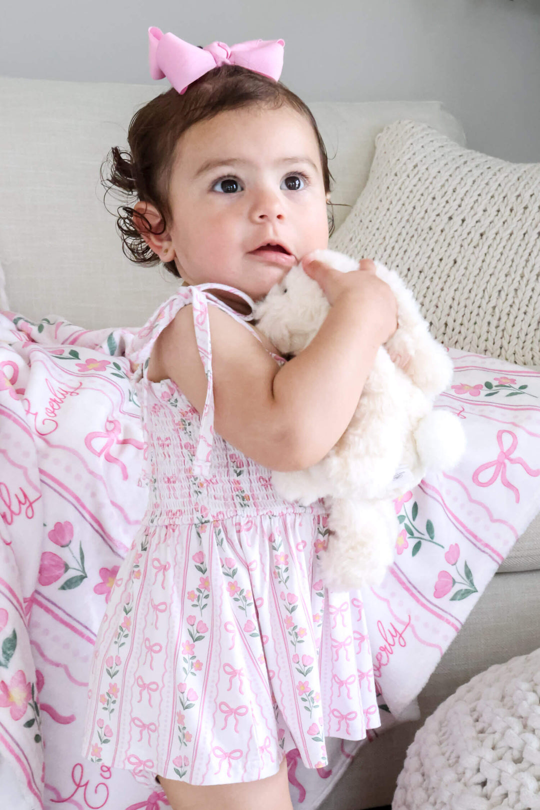 bamboo baby smocked twirl bodysuit with coquette garden bow and floral details