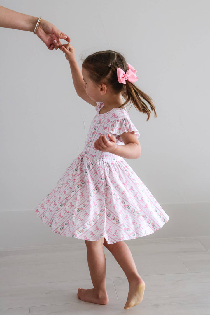 coquette garden ruffle twirl dress with bows and flowers