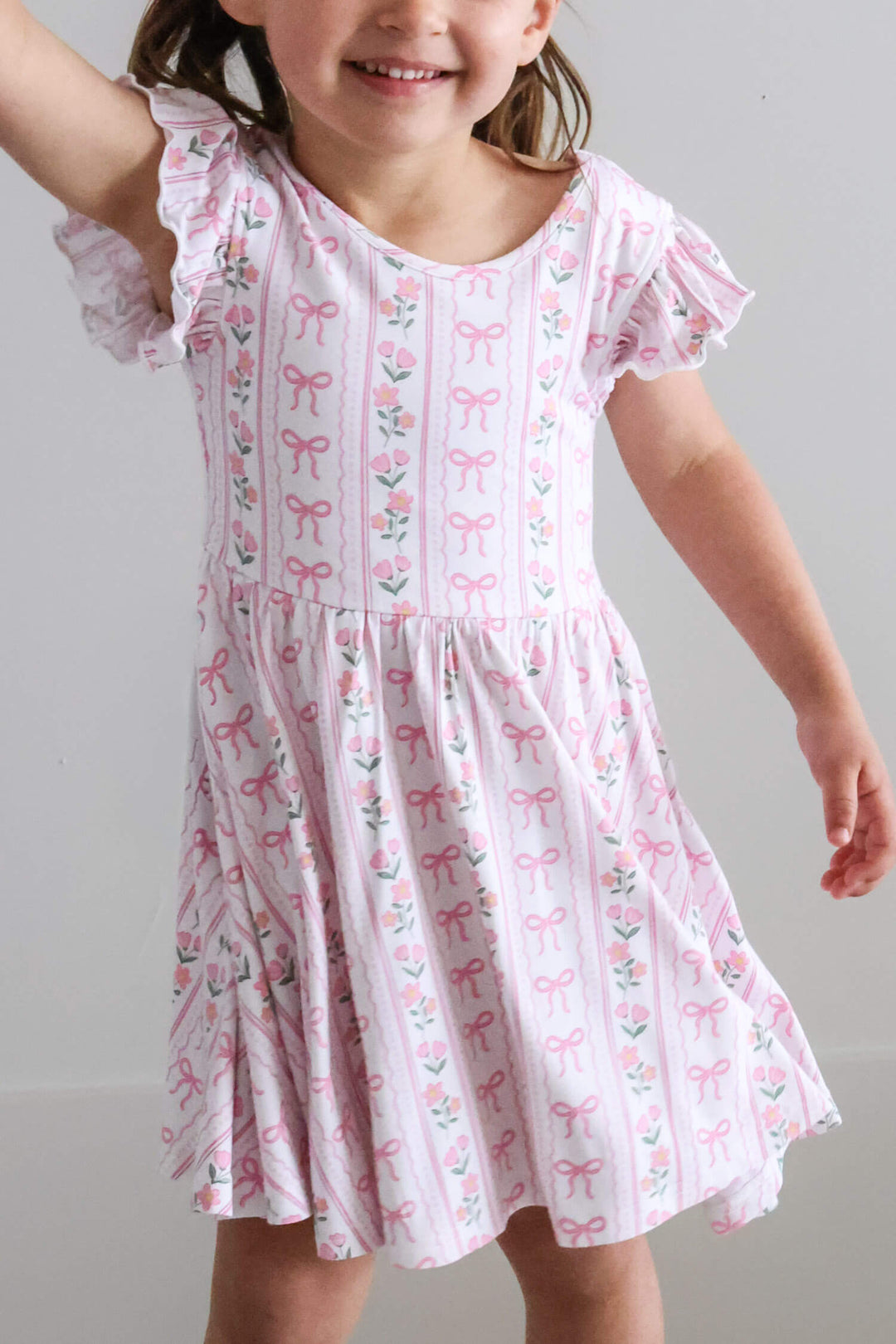 ruffle twirl dress with coquette garden floral and bow details