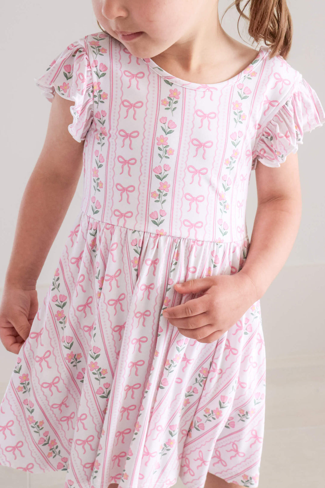 caden lane ruffle twirl dress featuring coquette garden bow design