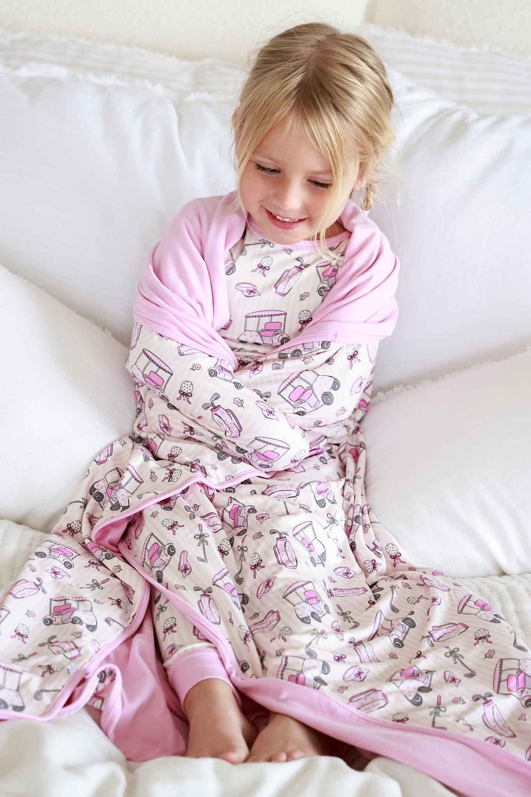 girl wrapped up in caddie crew pink double sided bamboo blanket