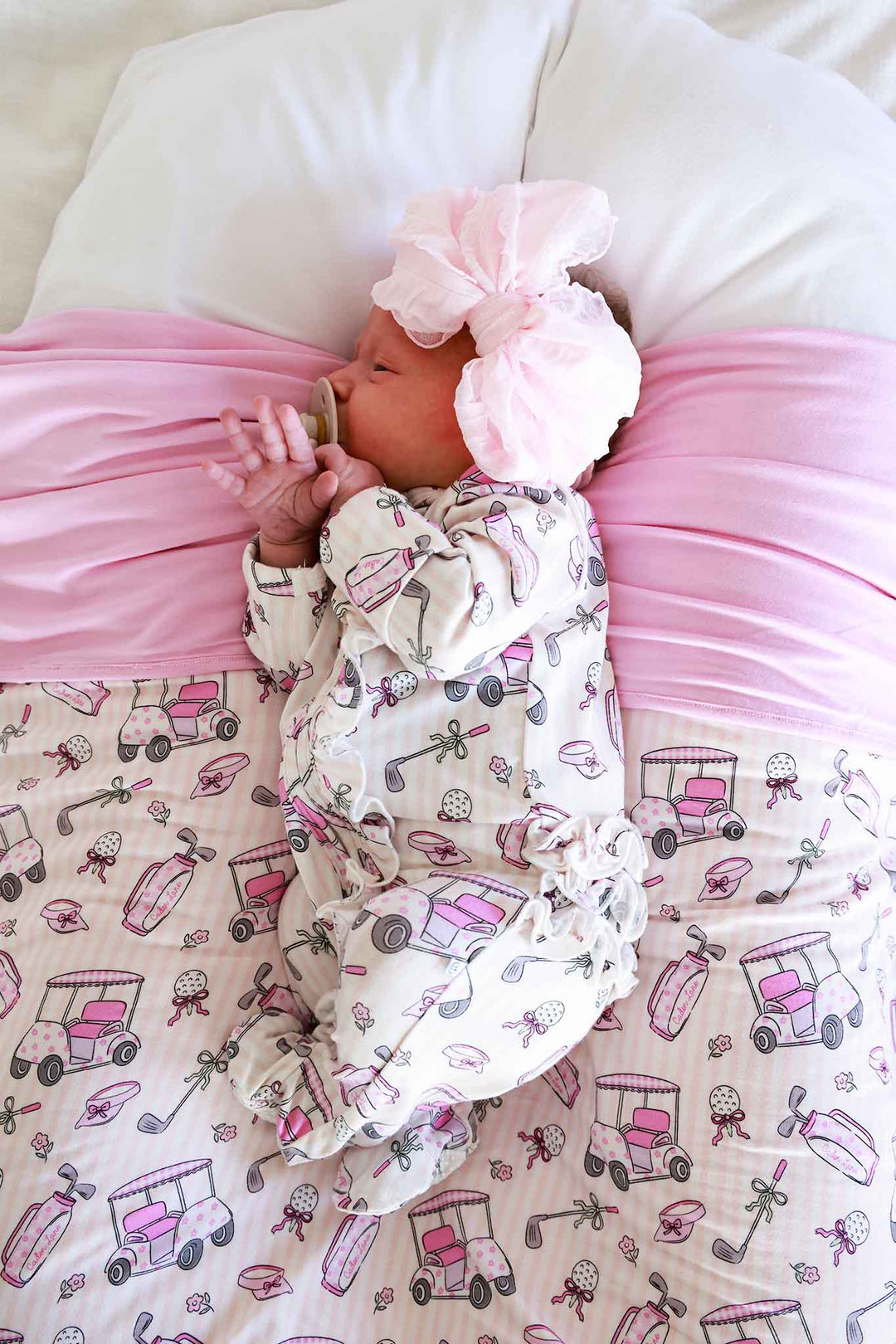 caddie crew pink ruffle zipper footie with pink ruffle bow