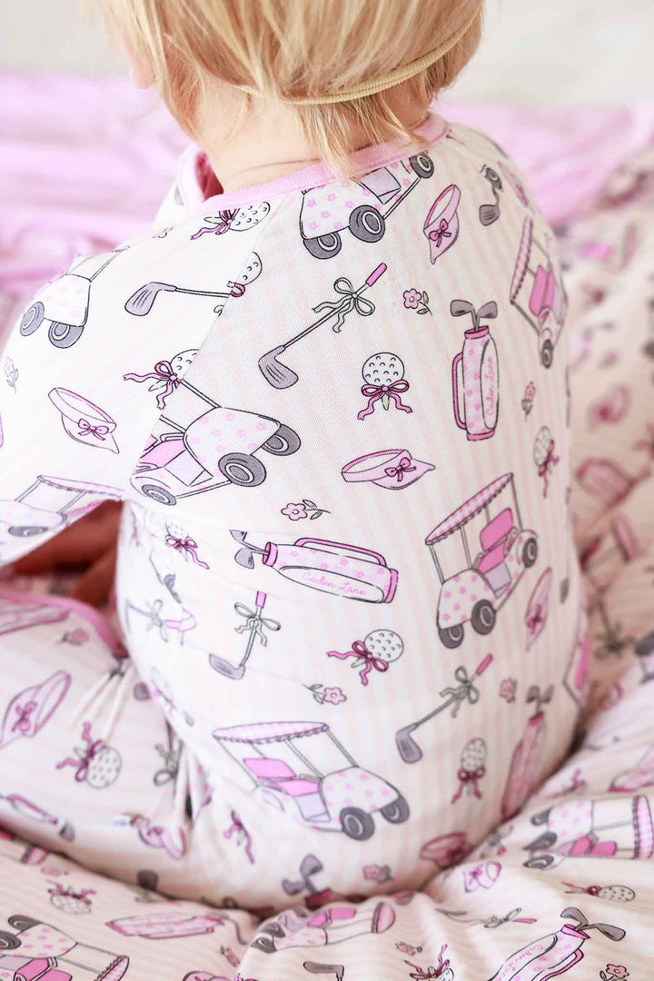 closeup of caddie crew pink convertible zip romper
