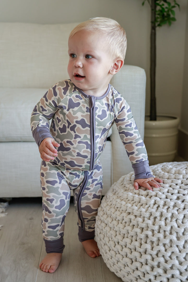 Camo cutie convertible zip romper seen from behind on baby toddler