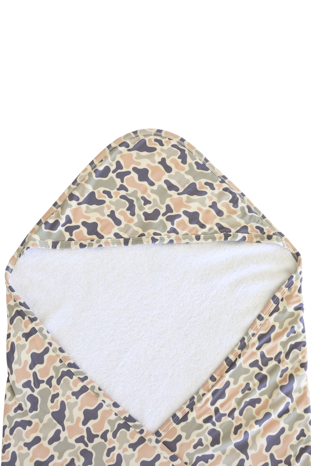 Flat lay of camo cutie bamboo hooded towel fully opened showing camo print exterior in tan, brown, and gray with white plush interior