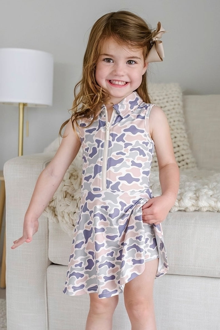 smiling girl in camo cutie athletic dress with matching shorts