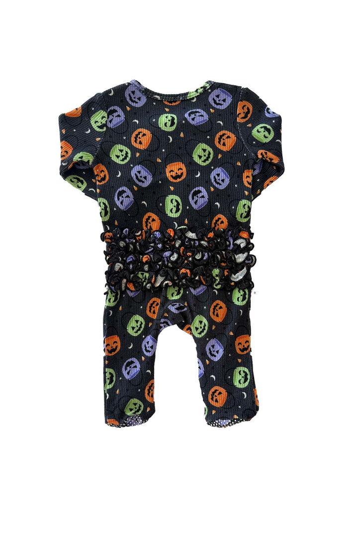 Back view of a bamboo waffle ruffle zipper footie in black with colorful jack-o-lantern print, laid flat showing ruffle waist detail