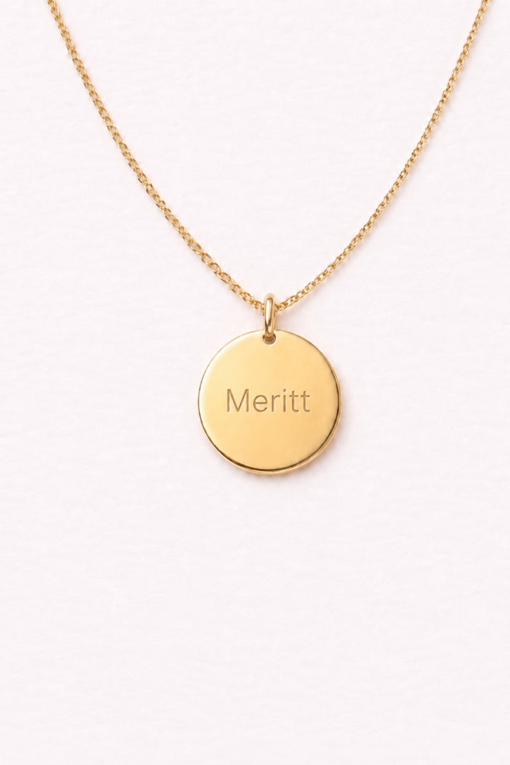 Caden Lane gold necklace with engraved "Meritt" circle disc pendant