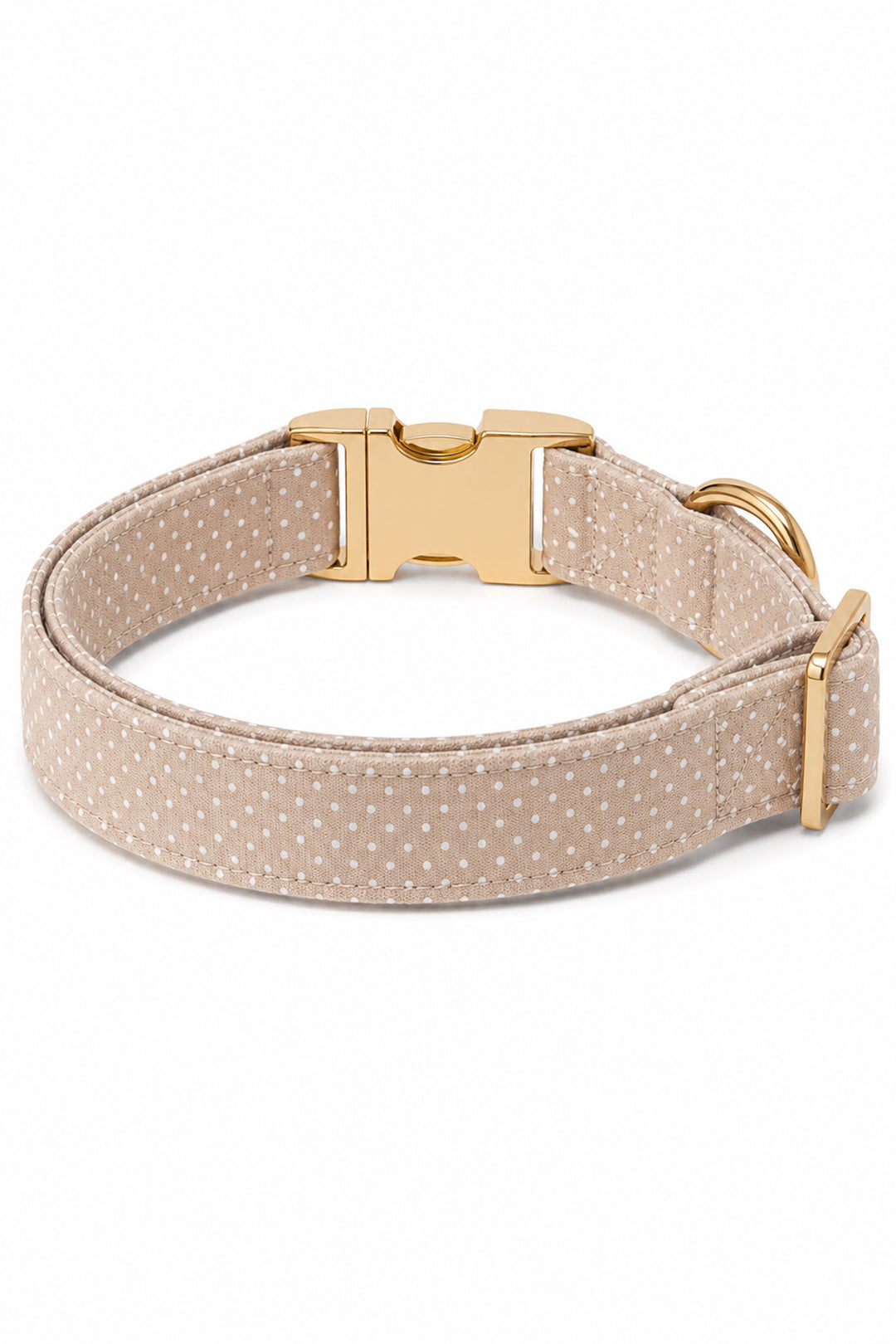 Back view of the latte brown polka dot dog collar showing the gold quick-release buckle, adjustment slider, and D-ring