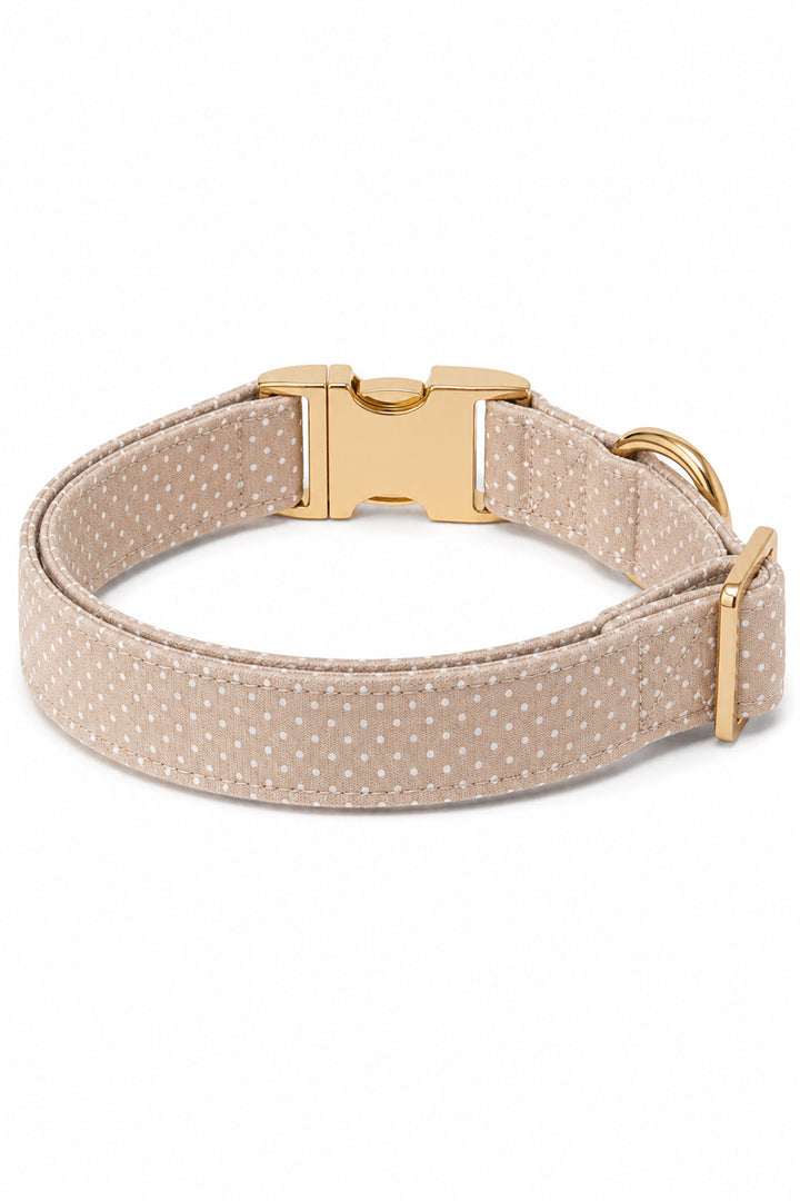 Back view of the latte brown polka dot dog collar showing the gold quick-release buckle, adjustment slider, and D-ring