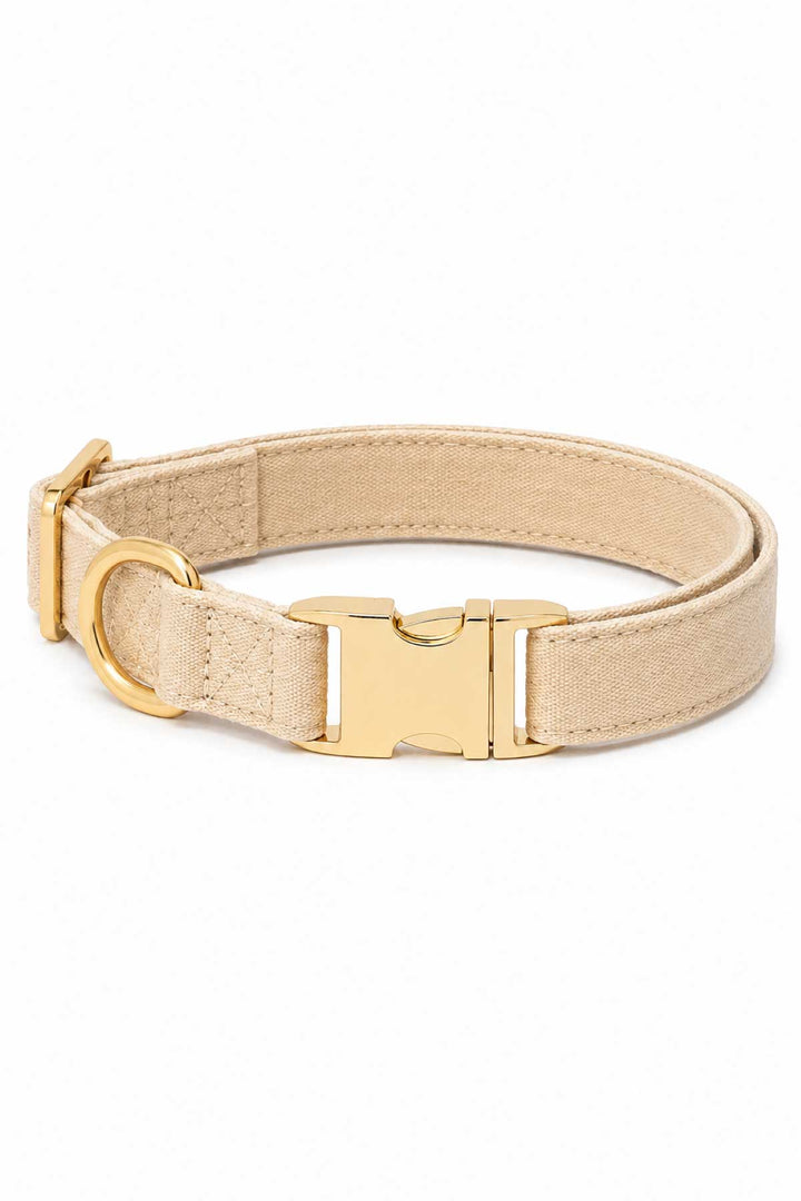 Caden Lane sand dune beige flax fabric dog collar with gold buckle and D-ring hardware, laying flat on white background