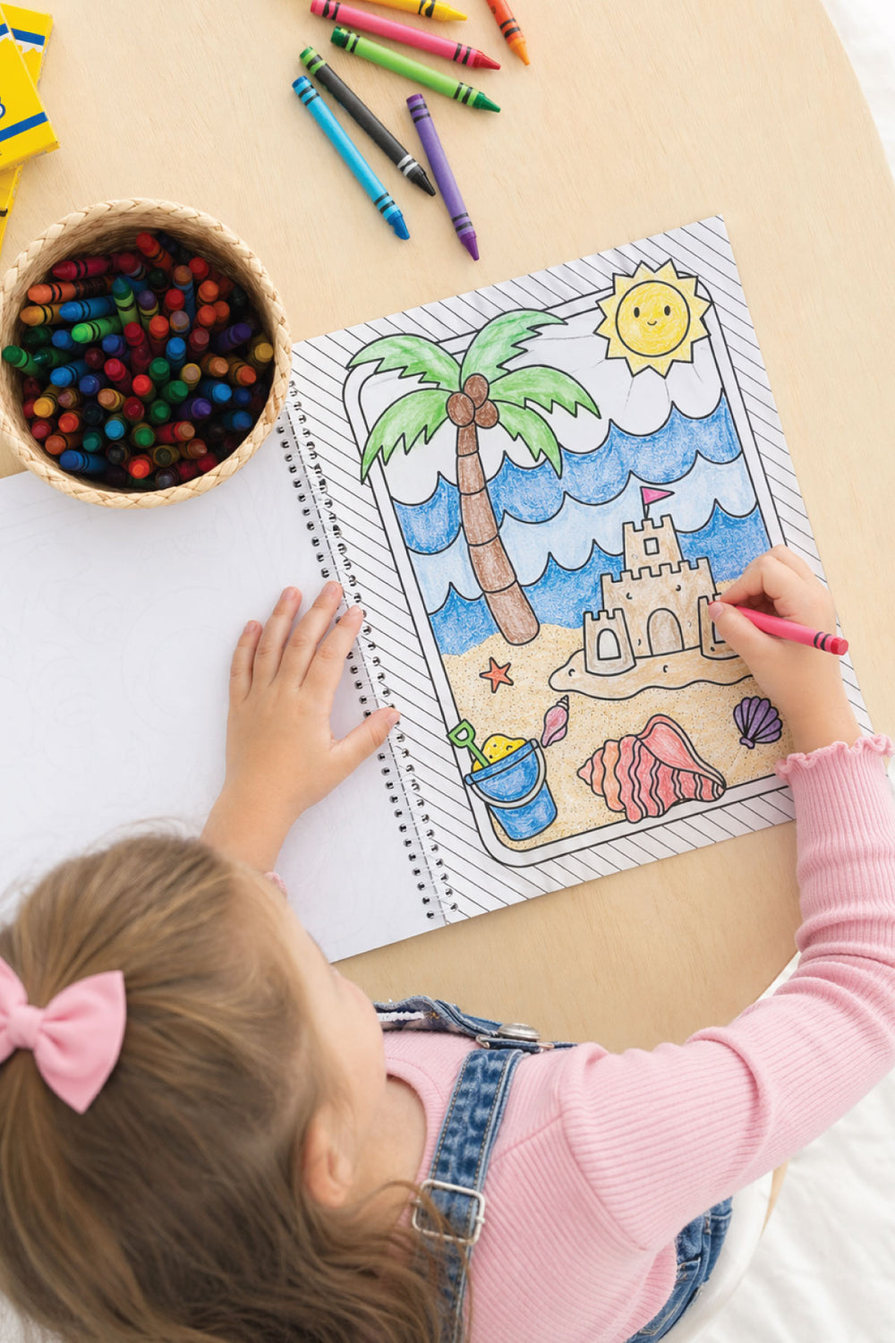 girl coloring beach themed coloring book