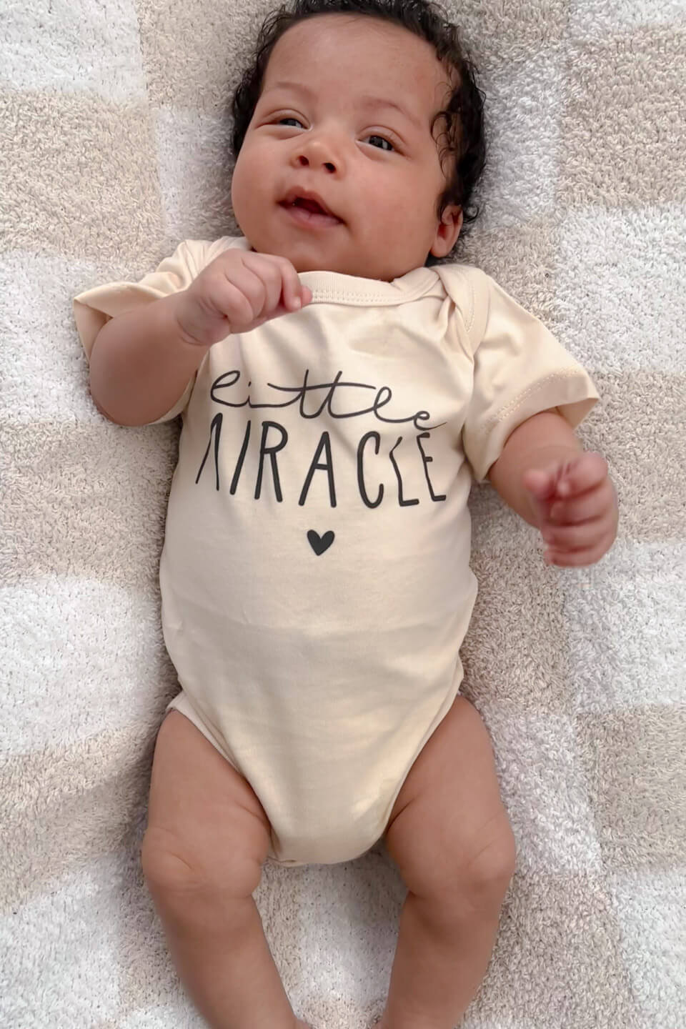 newborn in personalized little miracle cotton bodysuit, celebrating the ivf journey and new beginnings