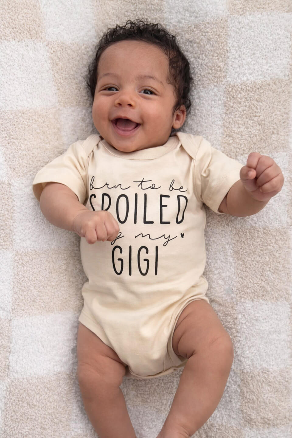 baby wearing personalized born to be spoiled graphic cotton bodysuit in natural