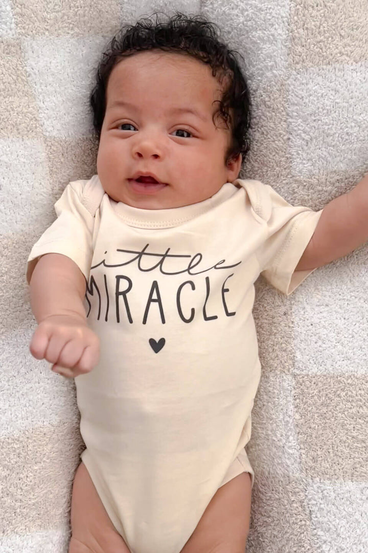 little miracle natural cotton infant bodysuit on baby, a cherished gift for ivf families