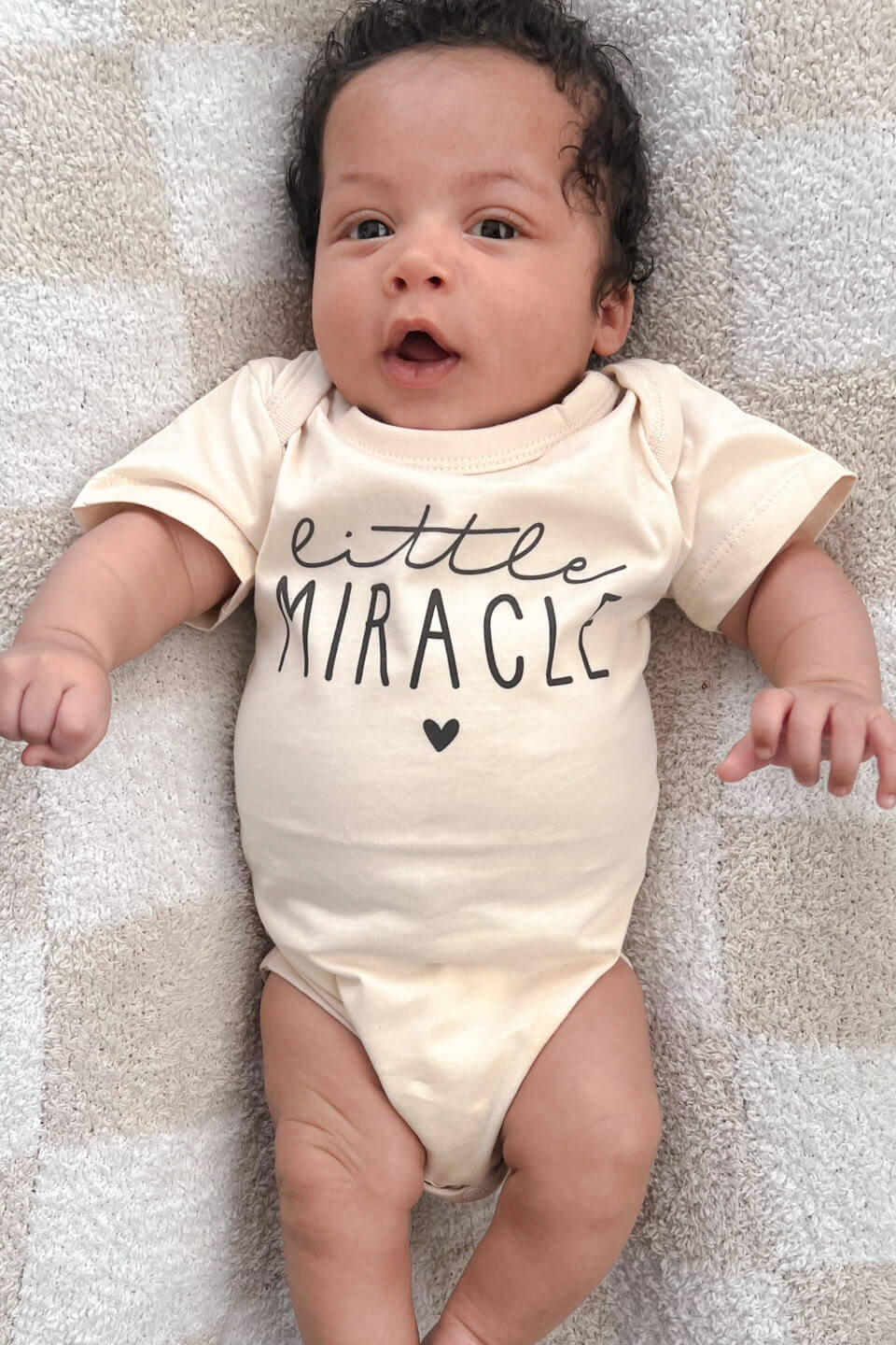 baby wearing personalized little miracle natural cotton bodysuit, a meaningful ivf celebration gift