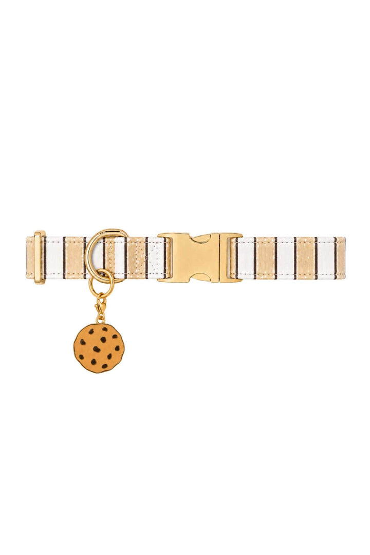 White striped pet collar with a chocolate chip cookie enamel charm attached, shown on white background
