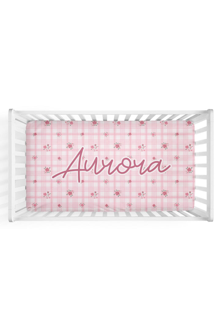 Personalized Primrose Plaid crib sheet with custom name in crib mockup