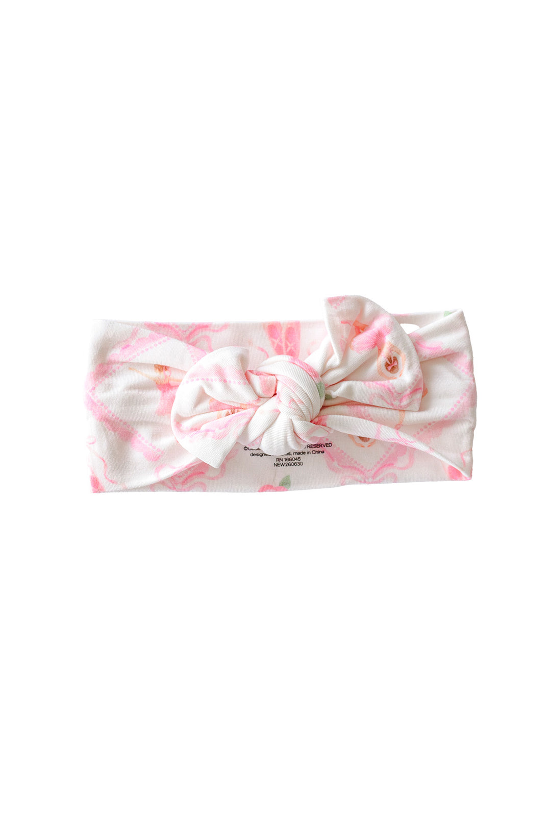 Caden Lane ballerina and roses pink print knotted bow headwrap, flat lay on a white background
