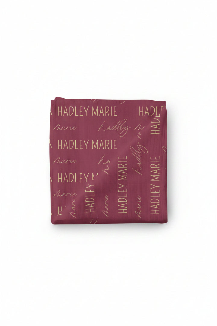 maroon and gold personalized swaddle 
