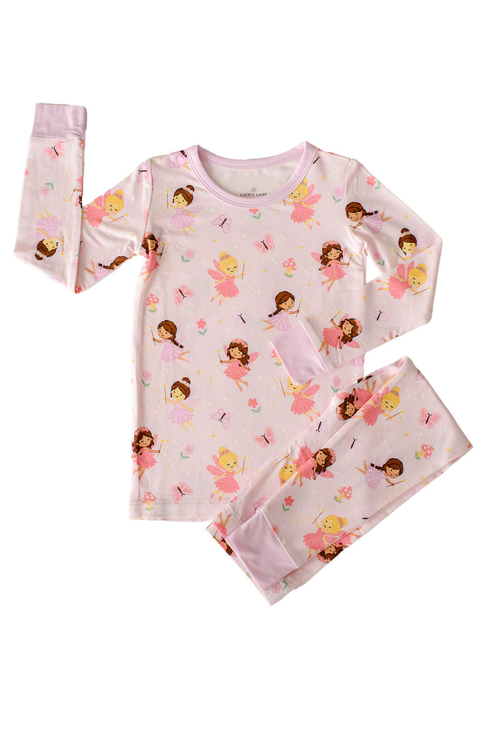 Flat lay of the Fairy Wishes glow-in-the-dark two-piece bamboo pajama set: long sleeve top and pants in light pink fairy print