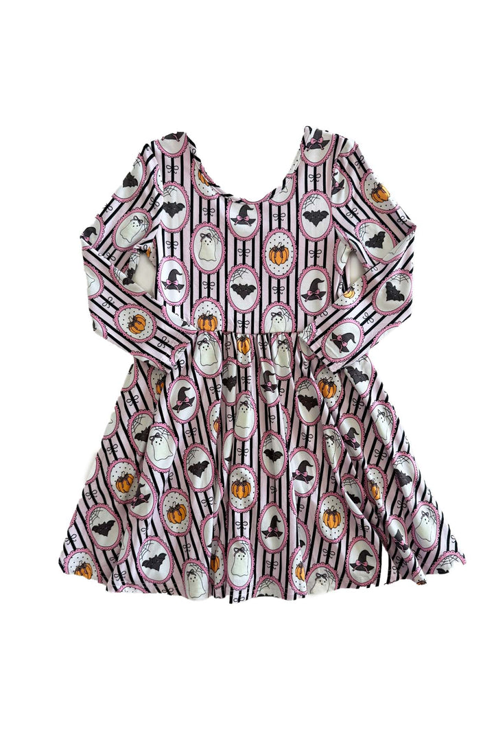 Purple and white striped Halloween twirl dress laid flat, featuring pumpkin, bat, ghost, and witch hat designs.