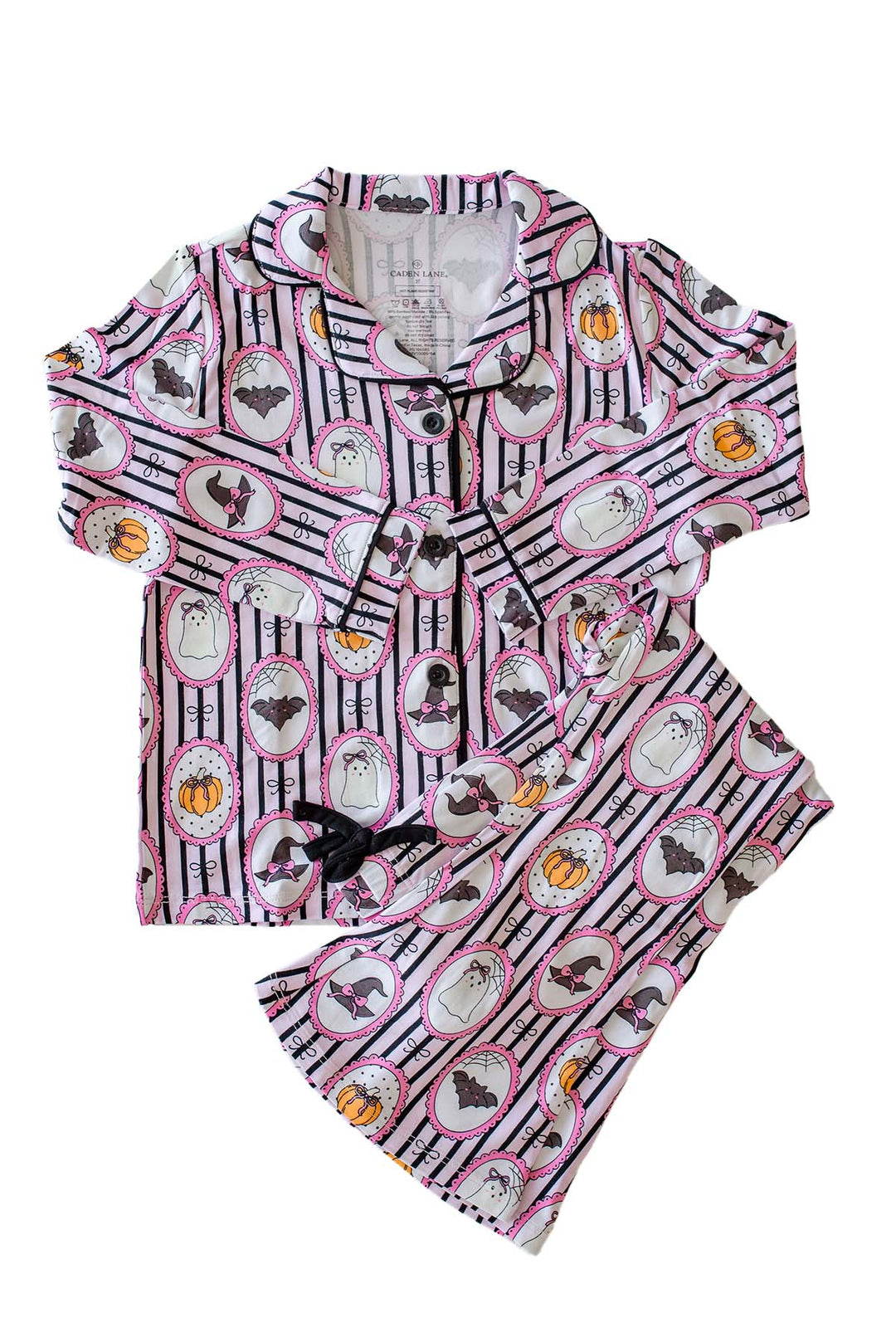 Caden Lane pink and black striped Halloween pajamas with ghost, bat, and pumpkin cameo print button-up two-piece set.