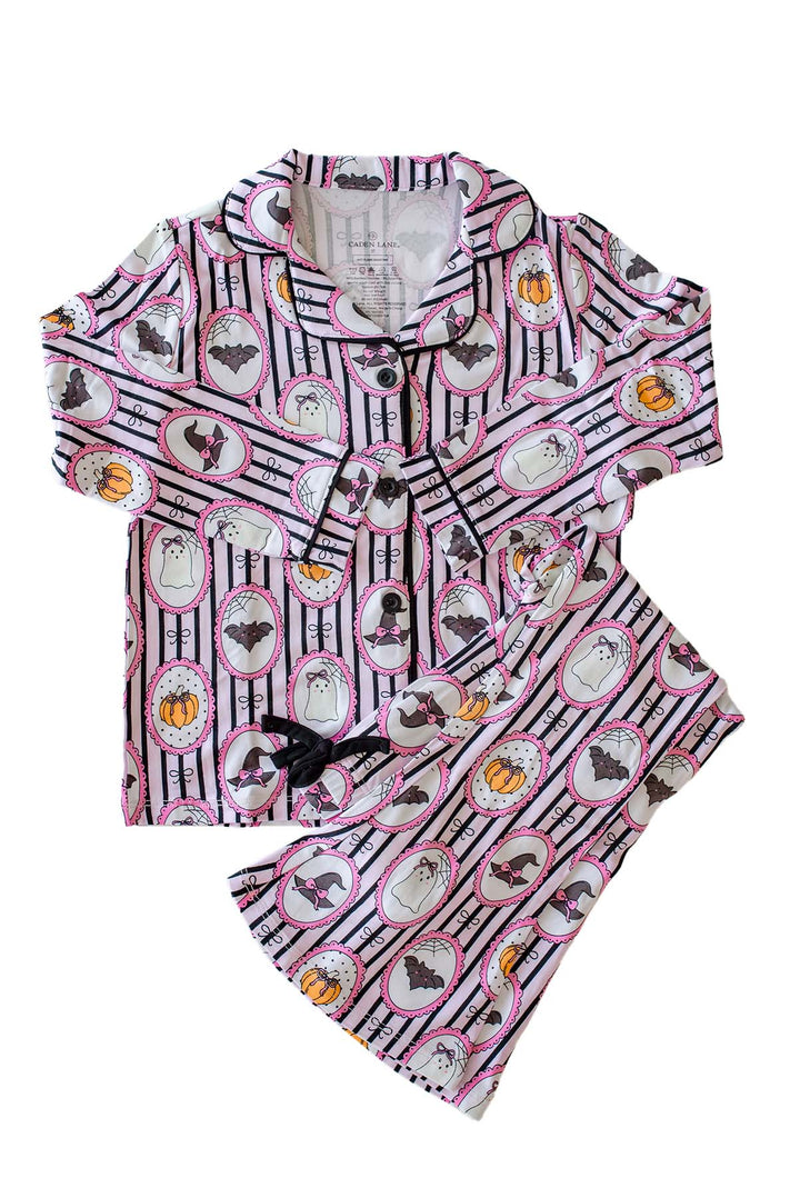 Caden Lane pink and black striped Halloween pajamas with ghost, bat, and pumpkin cameo print button-up two-piece set.